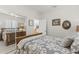 Bright bedroom with mirrored closet doors and a view to living area at 19043 N Aztec Point Dr, Surprise, AZ 85387