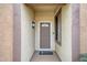 Front entry with security door and welcoming mat at 19043 N Aztec Point Dr, Surprise, AZ 85387