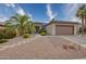 Single-story home with a two-car garage and desert landscaping at 19043 N Aztec Point Dr, Surprise, AZ 85387