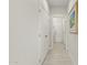 Bright hallway with tile floors and neutral walls at 19043 N Aztec Point Dr, Surprise, AZ 85387