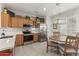 Modern kitchen with wood cabinets and stainless steel appliances at 19043 N Aztec Point Dr, Surprise, AZ 85387