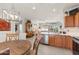 Modern kitchen with wood cabinets and stainless steel appliances at 19043 N Aztec Point Dr, Surprise, AZ 85387