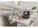Bright living room with comfortable seating and large windows at 19043 N Aztec Point Dr, Surprise, AZ 85387