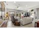 Bright living room with comfortable seating and large windows at 19043 N Aztec Point Dr, Surprise, AZ 85387