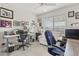 Home office with a desk, chair, and ample storage at 19043 N Aztec Point Dr, Surprise, AZ 85387