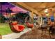 Relaxing patio with hanging chairs and sunset view at 2042 E Victor Rd Rd, Gilbert, AZ 85296