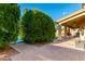 Landscaped backyard with lush greenery and pathway at 2042 E Victor Rd Rd, Gilbert, AZ 85296