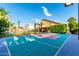 Private backyard basketball court with colorful surface at 2042 E Victor Rd Rd, Gilbert, AZ 85296