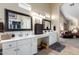 Double vanity bathroom with linen cabinet and plenty of space at 2042 E Victor Rd Rd, Gilbert, AZ 85296