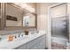 Bathroom with double sinks, vanity, and shower at 2042 E Victor Rd Rd, Gilbert, AZ 85296