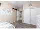 Bedroom with a world map and double door closet at 2042 E Victor Rd Rd, Gilbert, AZ 85296