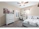 Bedroom with desk, dresser, and comfortable bed at 2042 E Victor Rd Rd, Gilbert, AZ 85296