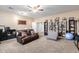 Spacious bonus room with leather seating and built-in shelving at 2042 E Victor Rd Rd, Gilbert, AZ 85296