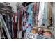 Spacious walk-in closet with ample hanging space and drawers at 2042 E Victor Rd Rd, Gilbert, AZ 85296