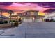 Two-story house with tile roof and three-car garage at 2042 E Victor Rd Rd, Gilbert, AZ 85296