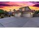 Two-story house with tile roof and three-car garage at 2042 E Victor Rd Rd, Gilbert, AZ 85296