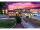 Two-story house with tile roof, three-car garage, and landscaped yard at 2042 E Victor Rd Rd, Gilbert, AZ 85296