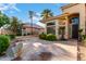 House entrance with stone walkway, landscaping, and a double door at 2042 E Victor Rd Rd, Gilbert, AZ 85296