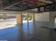 Garage with overhead storage and epoxy floor at 2042 E Victor Rd Rd, Gilbert, AZ 85296