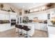 Modern white kitchen with center island and double ovens at 2042 E Victor Rd Rd, Gilbert, AZ 85296