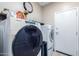 Laundry room with washer, dryer, and storage at 2042 E Victor Rd Rd, Gilbert, AZ 85296