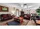 Gathering room with leather sofas and a large TV at 2042 E Victor Rd Rd, Gilbert, AZ 85296