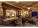 Outdoor patio bar with seating, perfect for entertaining at 2042 E Victor Rd Rd, Gilbert, AZ 85296