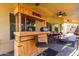 Rustic wooden bar with seating on the patio at 2042 E Victor Rd Rd, Gilbert, AZ 85296