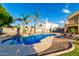Relaxing kidney-shaped pool with lounge chairs at 2042 E Victor Rd Rd, Gilbert, AZ 85296