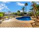Inviting kidney-shaped pool with surrounding patio and lounge chairs at 2042 E Victor Rd Rd, Gilbert, AZ 85296