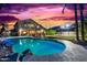 Inviting pool and spa with sunset backdrop at 2042 E Victor Rd Rd, Gilbert, AZ 85296