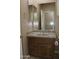 Bathroom features a vanity with a mirror, and a towel rack at 2335 W Muirfield Dr, Anthem, AZ 85086