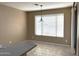 Bright breakfast nook featuring tile flooring, a window with blinds, and a modern pendant light fixture at 2335 W Muirfield Dr, Anthem, AZ 85086