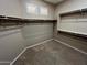 Spacious closet featuring carpeting, shelving, and plenty of room for storage at 2335 W Muirfield Dr, Anthem, AZ 85086