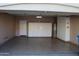 Garage featuring storage cabinets, water heater, and epoxy flooring at 2335 W Muirfield Dr, Anthem, AZ 85086