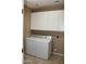 Laundry room with side-by-side washer and dryer with overhead storage cabinets at 2335 W Muirfield Dr, Anthem, AZ 85086