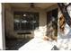 Covered patio with decorative rug and view into the yard at 2335 W Muirfield Dr, Anthem, AZ 85086