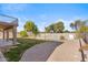 Landscaped backyard with a pool and a large covered patio at 2380 W Megan St, Chandler, AZ 85224