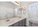 Bathroom with dual sinks and a large mirror at 2380 W Megan St, Chandler, AZ 85224