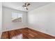 Bright bedroom with hardwood floors and a ceiling fan at 2380 W Megan St, Chandler, AZ 85224
