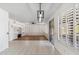 Bright dining room with hardwood floors and plantation shutters at 2380 W Megan St, Chandler, AZ 85224