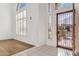 Bright entryway with tiled floors and iron front door at 2380 W Megan St, Chandler, AZ 85224