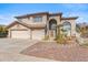 Two-story house with a three-car garage and landscaped front yard at 2380 W Megan St, Chandler, AZ 85224