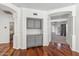 Hallway with built-in cabinets and hardwood floors at 2380 W Megan St, Chandler, AZ 85224