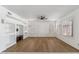 Spacious living room featuring hardwood floors and built-in shelving at 2380 W Megan St, Chandler, AZ 85224