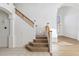 Elegant staircase with wood railing and carpeting at 2380 W Megan St, Chandler, AZ 85224