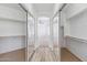 Spacious walk-in closet with mirrored doors and shelving at 2380 W Megan St, Chandler, AZ 85224