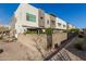 A fenced in patio behind a modern townhome with desert landscaping at 25311 N 19Th Ln, Phoenix, AZ 85085