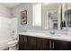 Neutral-toned bathroom with a shower-tub combo and undermount sink at 25311 N 19Th Ln, Phoenix, AZ 85085