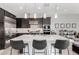 Contemporary kitchen showcases a large island with seating, stainless steel appliances, and plenty of counter space at 25311 N 19Th Ln, Phoenix, AZ 85085